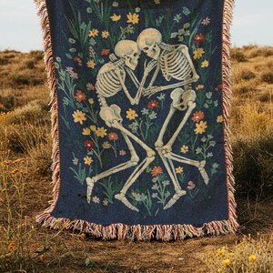 Skeletons laying together in a flower field throw blanket, inspired by in a week by hozier tapestry