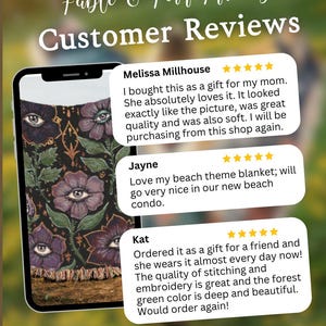 May include: A smartphone screen displaying three five-star customer reviews for Fable & Fern Threads. The screen shows a textile with a dark background, purple flowers with eye centres, and gold accents. Text includes customer names and feedback.