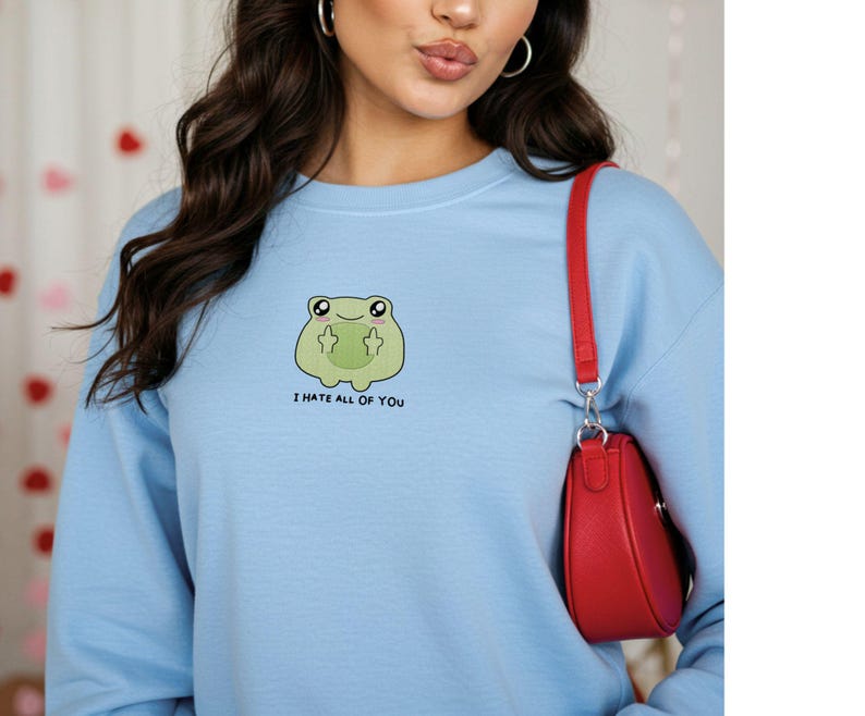 Frog flipping the bird with the text i hate all of you in black below Embroidered Sweatshirt Funny Frog Gift Goblincore Frog Lover Gift Cool Frog Outfit Frog Retro Meme Green Frog Embroidered Crewneck