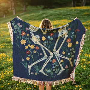 Skeletons laying together in a flower field throw blanket, inspired by in a week by hozier tapestry