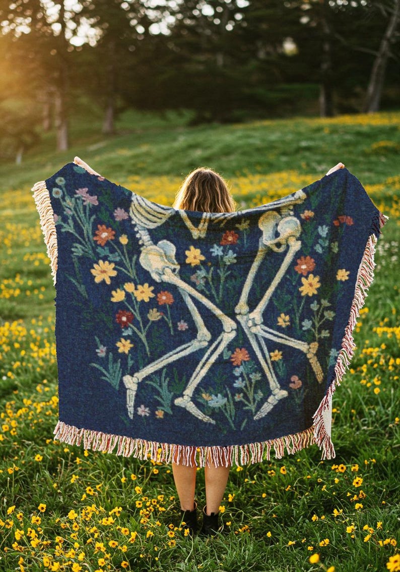 Skeletons laying together in a flower field throw blanket, inspired by in a week by hozier tapestry