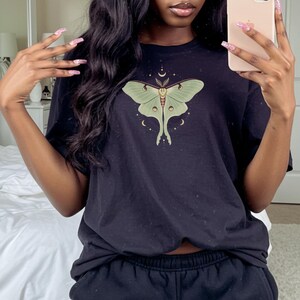 Black T-shirt with luna moth and crescent moon and celestial stars