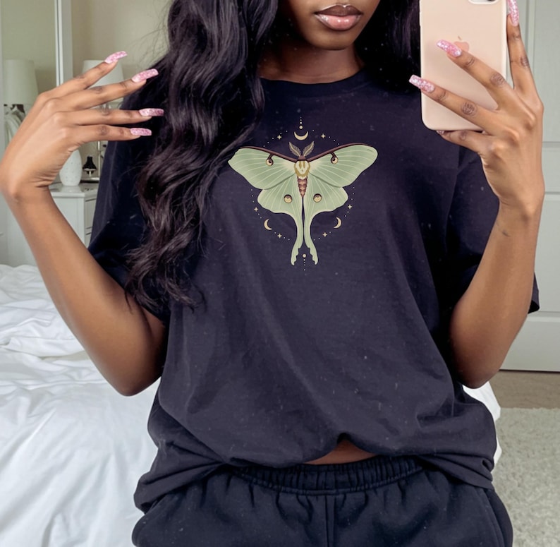 Black T-shirt with luna moth and crescent moon and celestial stars