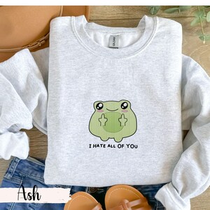 Frog flipping the bird with the text i hate all of you in black below Embroidered Sweatshirt Funny Frog Gift Goblincore Frog Lover Gift Cool Frog Outfit Frog Retro Meme Green Frog Embroidered Crewneck