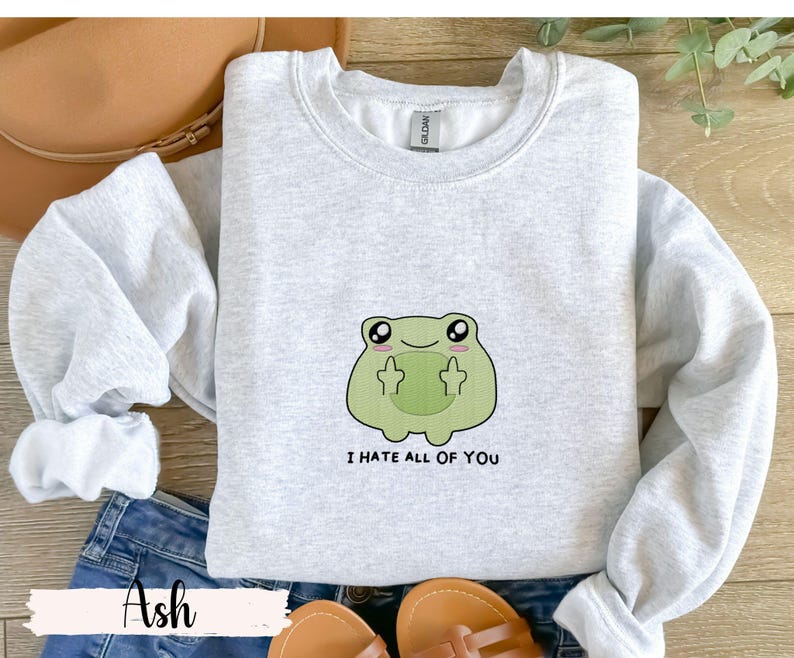 Frog flipping the bird with the text i hate all of you in black below Embroidered Sweatshirt Funny Frog Gift Goblincore Frog Lover Gift Cool Frog Outfit Frog Retro Meme Green Frog Embroidered Crewneck