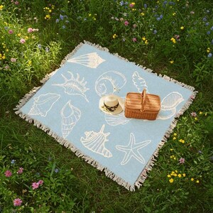 light blue blanket with white seashells, vintage sealife coastal decor nautical theme tapestry