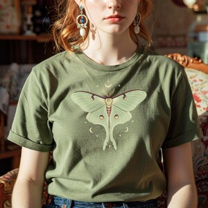 Moss green T-shirt with luna moth and crescent moon and celestial stars