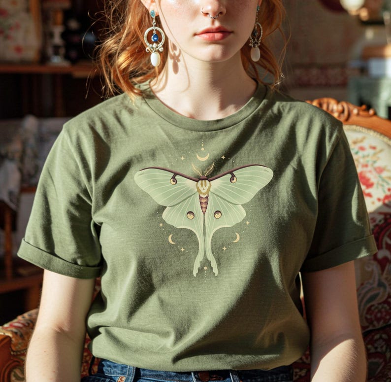 Moss green T-shirt with luna moth and crescent moon and celestial stars
