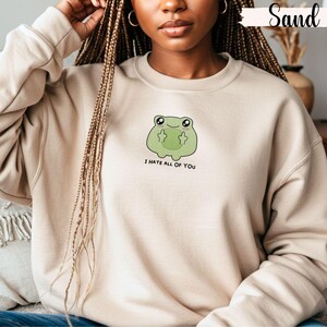 Frog flipping the bird with the text i hate all of you in black below Embroidered Sweatshirt Funny Frog Gift Goblincore Frog Lover Gift Cool Frog Outfit Frog Retro Meme Green Frog Embroidered Crewneck
