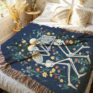 Skeletons laying together in a flower field throw blanket, inspired by in a week by hozier tapestry