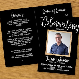 May include: Black and gold funeral announcement card with a photo of a man in a blue shirt and glasses. The text reads "Celebrating the life of Jacob Wilson, June 1, 1960 - July 22, 2021. Saturday, July 24, 2021 from 1:00pm to 4:00pm, St. Peter Church, 1245 Main Street, San Diego, CA 92020."