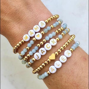 Custom Name Bracelet for Grandma – Personalized Beaded Stack with Grandkids’ Names – Gold & Pastel Gift – Mother’s Day Jewelry
