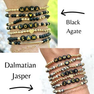 Stacked stretch beaded bracelets with gold-tone and pale-blue beads; white alphabet beads spell names for a personalized kids name bracelet set.
