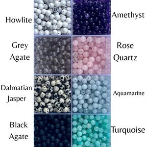 May include: A collection of gemstone beads in various colors, including white Howlite, dark purple Amethyst, grey Agate, pink Rose Quartz, Dalmatian Jasper, light blue Aquamarine, black Agate, and turquoise. Each type of bead is labeled with its name.