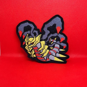 May include: Embroidered iron-on patch featuring a black, red, and yellow Pokemon character with sharp claws and a segmented body.