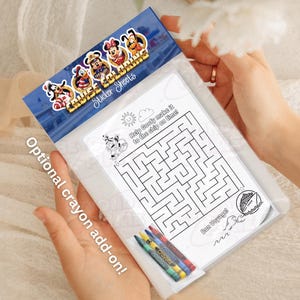 May include: A clear plastic packet containing a white paper activity sheet with a black and white maze, a cruise ship illustration, and the text Help Goofy make it to the ship on time! and Bon Voyage!, with four colorful crayons included.