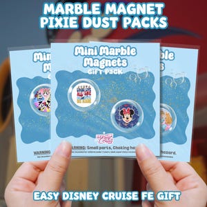 May include: Three packs of "Mini Marble Magnets" with Disney character designs. Each pack contains two magnets. The text "MARBLE MAGNET PIXIE DUST PACKS" and "EASY DISNEY CRUISE FE GIFT" are visible.