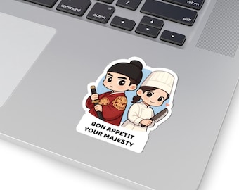 May include: A sticker featuring two cartoon chefs. One chef wears a red outfit and holds a knife and food. The other chef wears a white uniform and holds a knife. The sticker has the text "BON APPETIT YOUR MAJESTY".