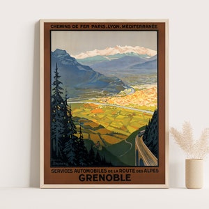 May include: A vintage travel poster advertising train and automobile services to Grenoble, France. The poster features a scenic view of the city nestled in the French Alps with snow-capped mountains in the background. The text reads "Chemins de Fer Paris-Lyon-Mediterranee Services Automobiles de la Route des Alpes Grenoble".