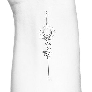 May include: A simple line art tattoo design featuring a crescent moon, a heart, and a stylized swirl. The design is vertical and includes small dots.