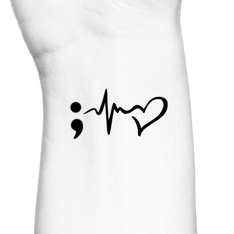 May include: Black and white tattoo design featuring a semicolon, a heartbeat line, and a heart.