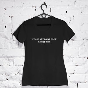 May include: Black t-shirt with white text that reads "We are not going back." and "Harris 2024".
