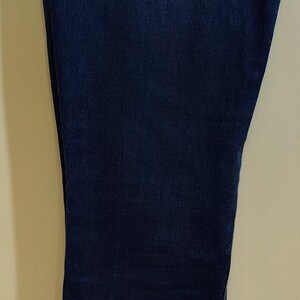 May include: A set of three ceramic nesting bowls in shades of blue, green, and white. The bowls feature a speckled glaze and a simple, modern design. The largest bowl measures approximately 8 inches in diameter.