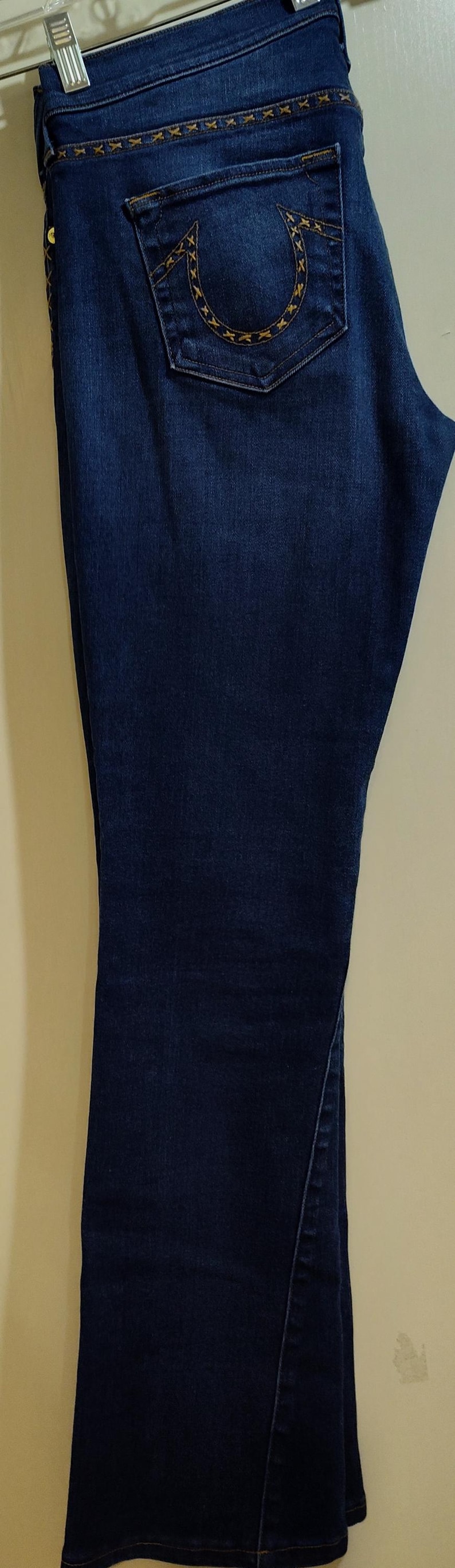 May include: A set of three ceramic nesting bowls in shades of blue, green, and white. The bowls feature a speckled glaze and a simple, modern design. The largest bowl measures approximately 8 inches in diameter.