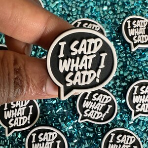 May include: A set of black and white speech bubble iron-on patches with the text "I said what I said!"