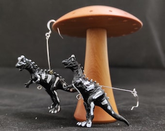 Carnotaurus Dinosaur Earrings - skeletal black with white accents and silver findings
