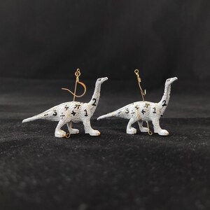Diplodocus Dinosaur Earrings - white with mathematic symbols and gold accents