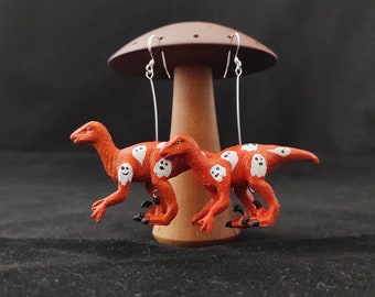 Velociraptor Dinosaur Earrings - orange with floating ghosts