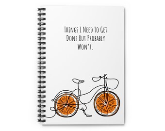 May include: A white spiral notebook with the text "Things I need to get done but probably won't."  A black and white line drawing of a bicycle with orange wheels shaped like orange slices.