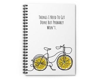 May include: A white spiral notebook with the text "Things I need to get done but probably won't."  A black and white line drawing of a bicycle with lemon slices for wheels.