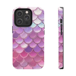 May include: A phone case featuring a mermaid scale pattern in pink, purple, and white hues. The case has a shiny finish and a black edge. The design wraps around the back and sides of the phone case.