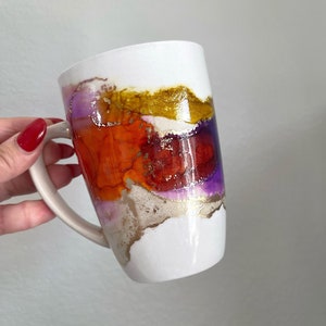 Candy apple red, butterscotch, plum, and gold alcohol ink mug