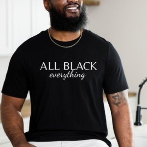 May include: A black t-shirt with the text "ALL BLACK everything" in white lettering.