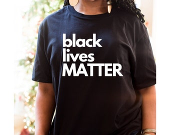 May include: Black t-shirt with the text "black lives matter" printed in white.