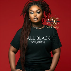May include: A black t-shirt with the text "ALL BLACK everything" in white lettering. The shirt is being worn by a person with long dreadlocks. The background is red. The text "MC MELANIN CHOCOLATE Tees & Things" is also visible on the shirt.