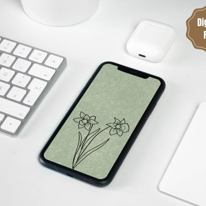 以下が含まれることがあります： 緑色の背景に、黒い輪郭で描かれた2つの水仙の花が描かれたデジタル携帯電話の壁紙です。