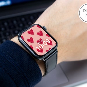 May include: A black smartwatch with a pink watch face featuring a pattern of red hearts and the time 10:09. The watch face also displays the date, FRI 23.