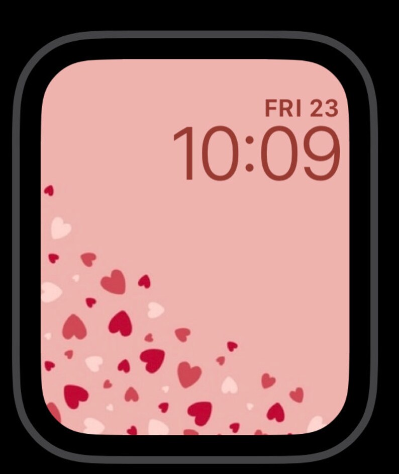 May include: A pink Apple Watch face with a digital clock displaying "FRI 23 10:09" and a pattern of pink and white hearts in the lower left corner.