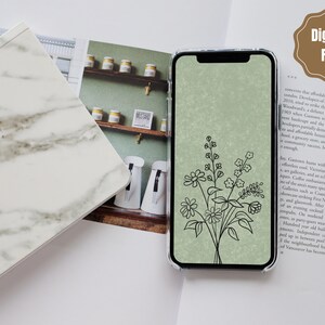 以下が含まれることがあります： 緑色の背景に、黒い線で描かれた花束が描かれたデジタル携帯電話の壁紙です。