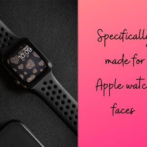 K&ouml;nnte beinhalten: Schwarze Apple Watch mit schwarzem Armband und einem Zifferblatt mit Herz-Muster, das "FRI 23" und "10:09" anzeigt.