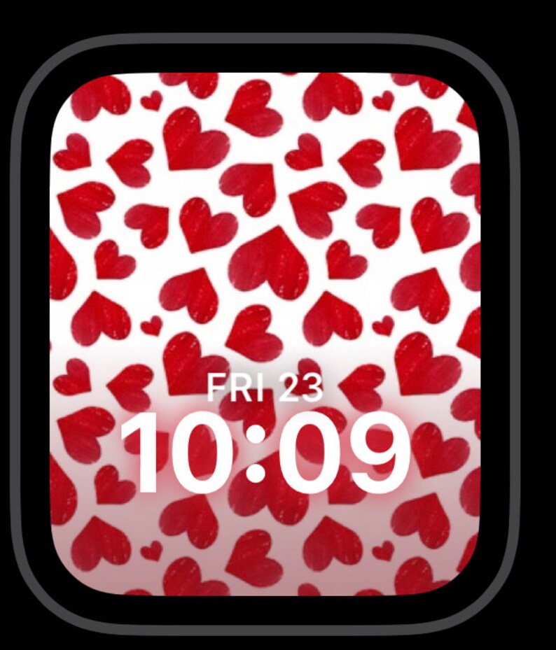 May include: A white Apple Watch face with a red heart pattern and the time 10:09 displayed. The date is displayed as FRI 23.