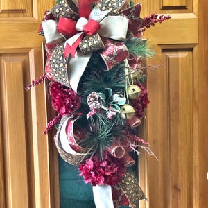 Luxury Christmas Swag Wreath with Leopard Print, Red Hydrangeas, Jingle Bells, and Pine Accents