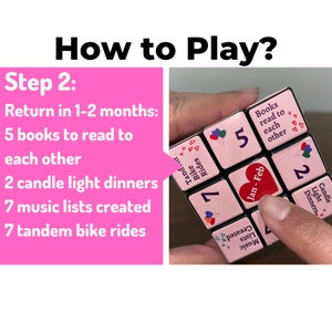May include: A pink cube with six sides, each with a different activity to do with a partner. The activities include: "Tandem Bike Rides", "Music Lists Created", "Candle Light Dinners", "Jan-Feb", "Books Read to Each Other", and "Bike Rides".
