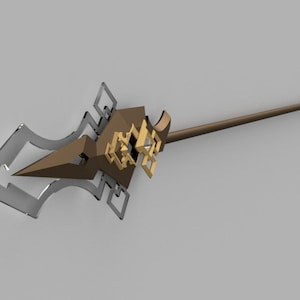 Puede incluir: Una lanza dorada y marrón con un diseño geométrico decorativo en la punta. La lanza está hecha de metal y tiene un eje de madera.