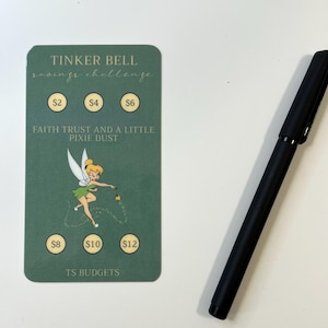 May include: A green card with a Tinker Bell savings challenge. The card has a picture of Tinker Bell with the text "Faith Trust and a Little Pixie Dust". The card has a grid of circles with dollar amounts from $2 to $12. The text "TS Budgets" is at the bottom of the card.