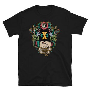 May include: Black t-shirt with a graphic design of two hands shaking, surrounded by flowers, birds, and the text "Straight Edge Sisterhood".